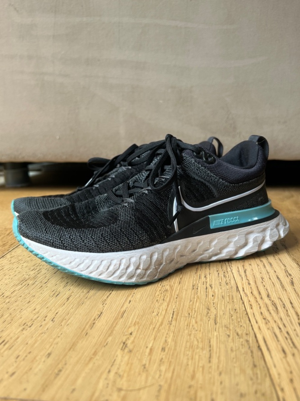 Nike Women’s React Infinity Flyknit Running Shoe with Aqua Accents